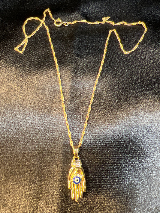 Gold Hand Holding the Evil Eye Necklace